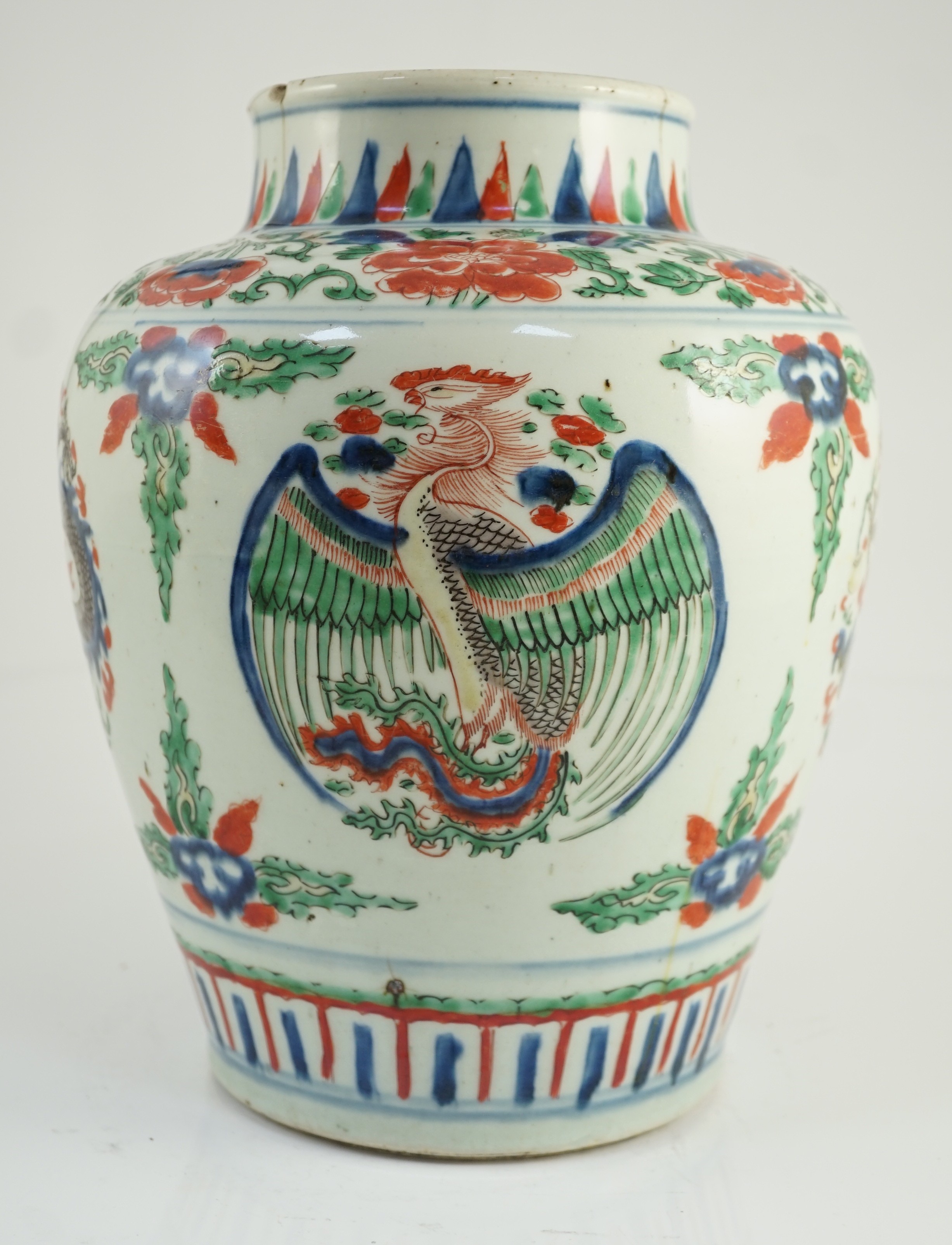 A Chinese Transitional wucai ‘dragon and phoenix roundel’ vase, 17th century, 30cm high, cracks